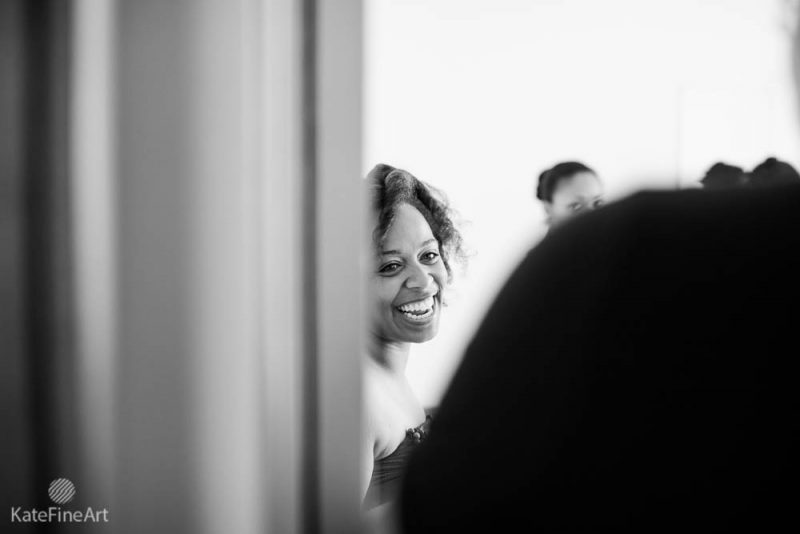 bride laughing while preparing for her wedding ceremony at mayo beach in edgewater, md.