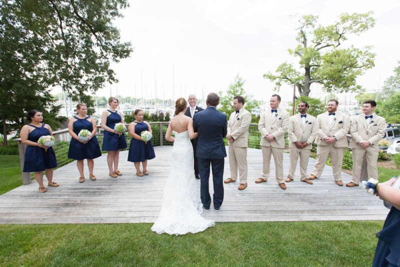 bride and groom outdoor ceremony with Port Annapolis in the background
