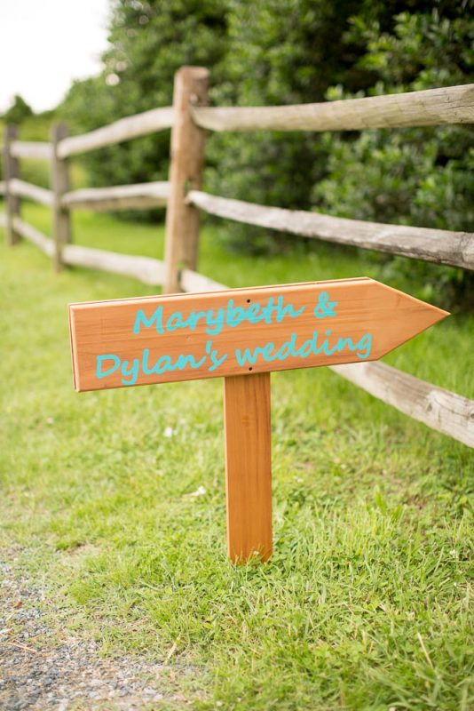 Entrance to a wedding at Hemlock Farm with custom sign