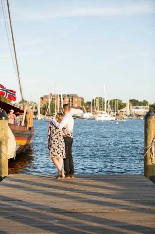 couple looking out to the water in annapolis for an engagement session