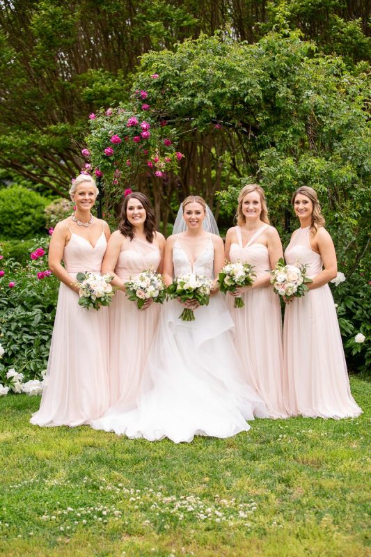 bride and bridesmaids at the superintendants gardens in annapolis