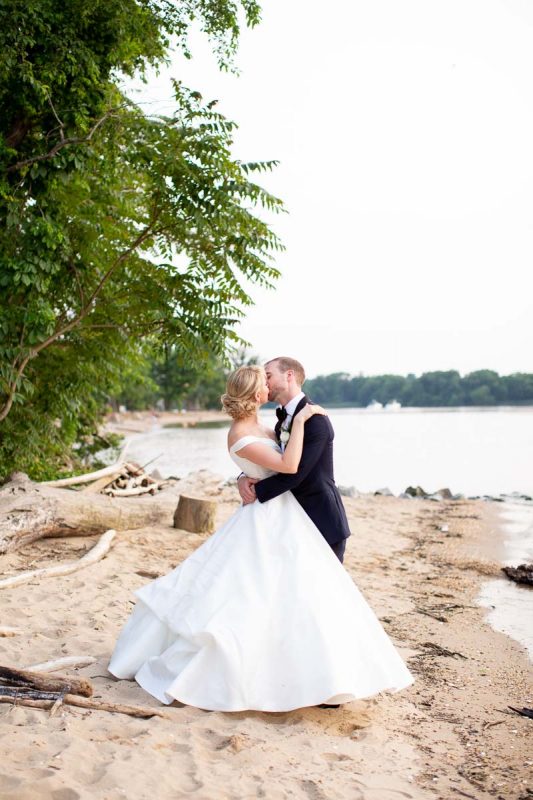 Bride and groom on the beach at Great Oak Manor