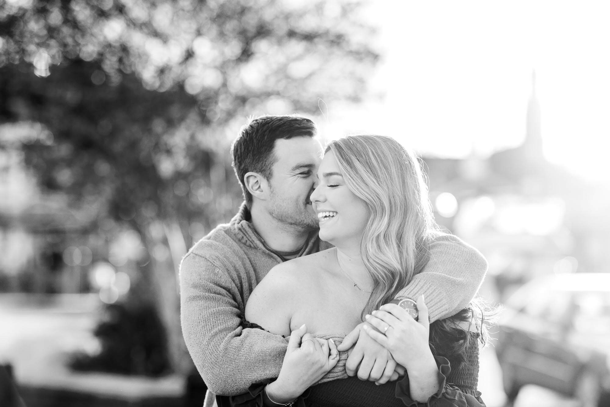 Black and White photo of a couple hugging in Annapolis in the fall