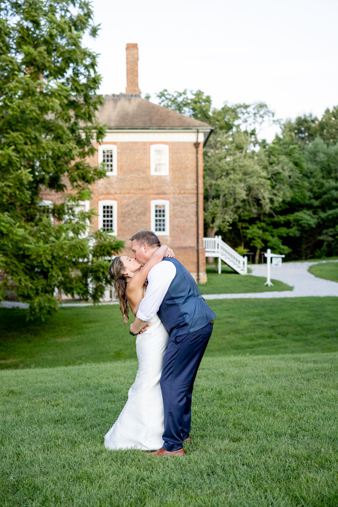 Bride and groom kissing at the historic London Town and Gardens wedding venue.